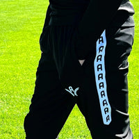 Bas d'entraînement Aways Performer noir porté - détail poche zippée et logo